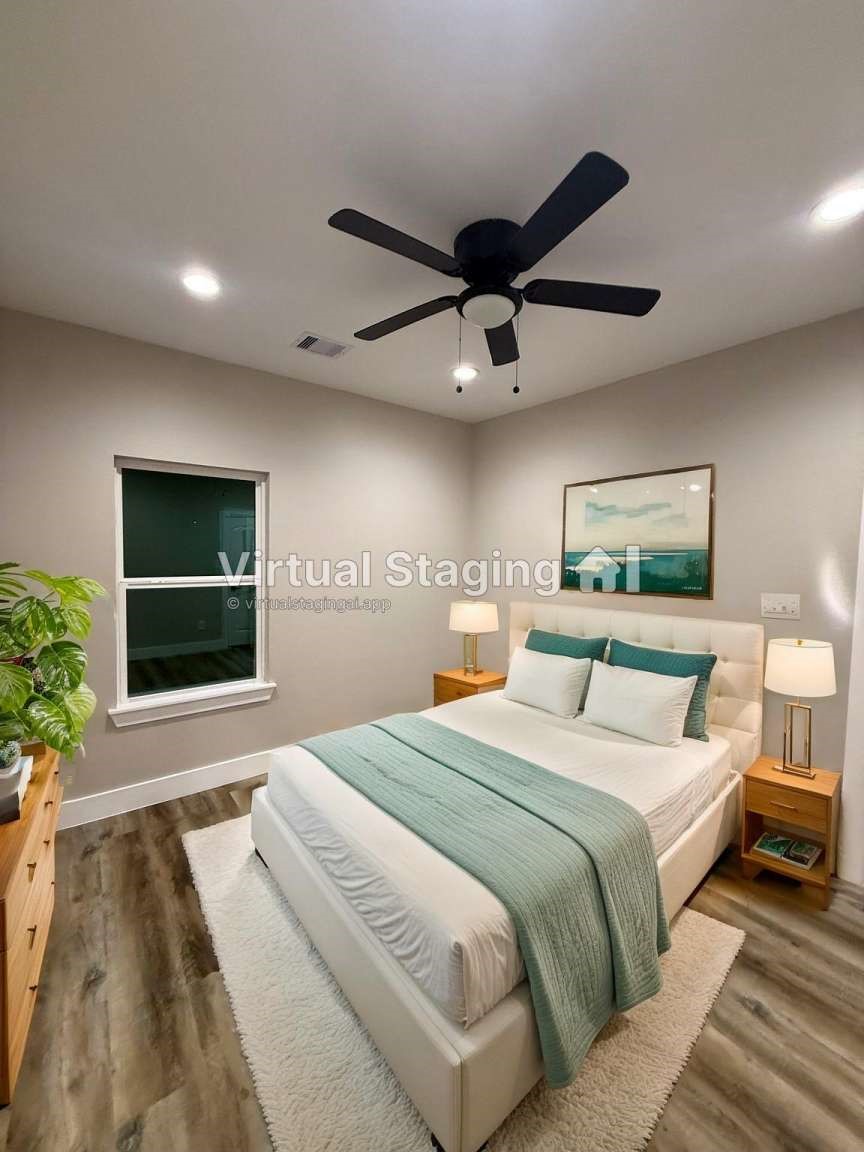 1620 Sam Wilson Street Houston, TX 77020 - Photo 38 of 40 a bedroom with a large bed and a window