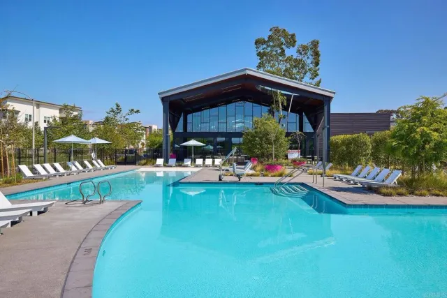 a view of a swimming pool with outdoor seating and yard