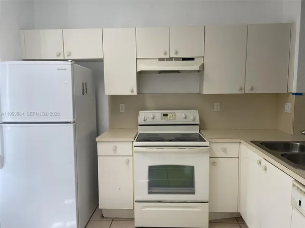 a view of a kitchen with washer and dryer