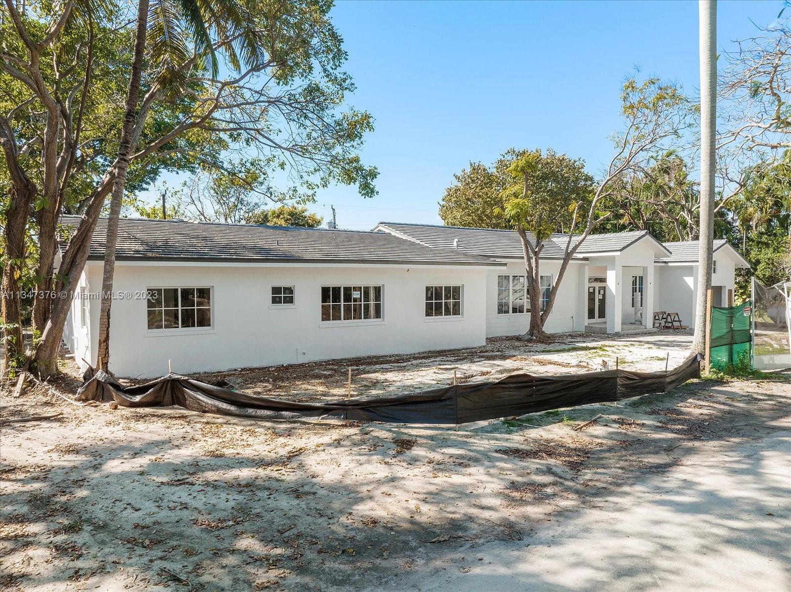 6230 Southwest 60th Street Miami, FL 33143 - Photo 11 of 57 a view of house with yard and swimming pool