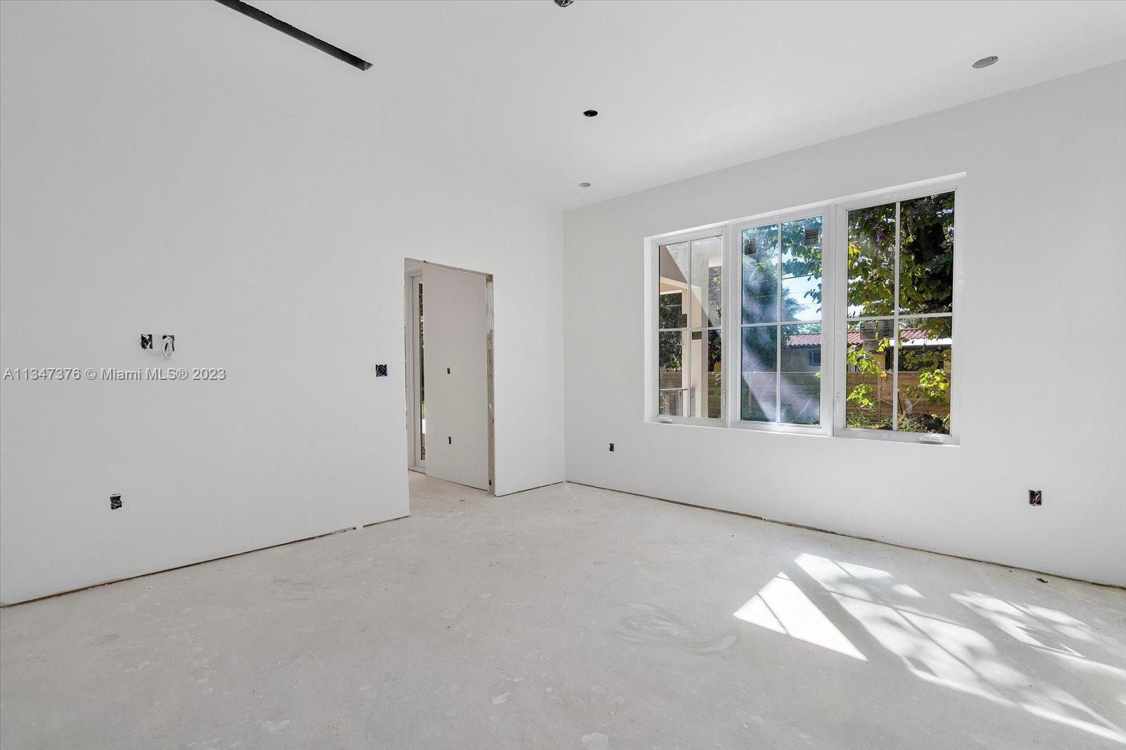 6230 Southwest 60th Street Miami, FL 33143 - Photo 23 of 57 a view of an empty room with a window