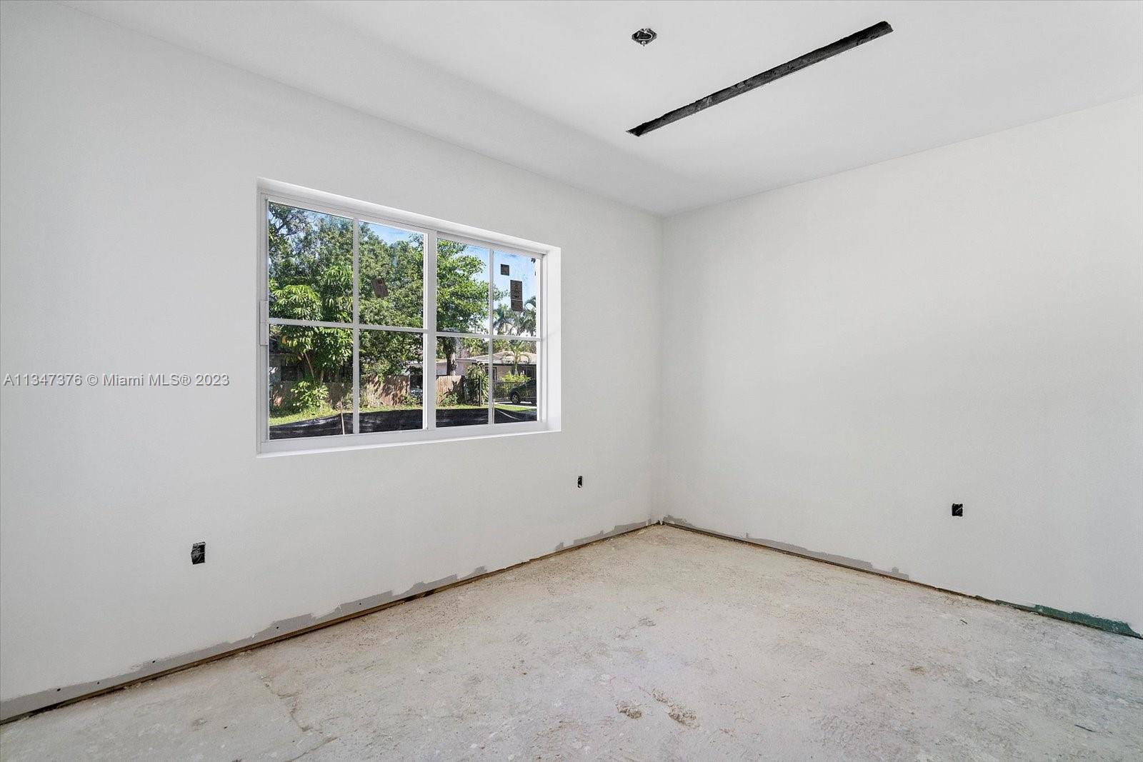 6230 Southwest 60th Street Miami, FL 33143 - Photo 29 of 57 a view of an empty room with a window
