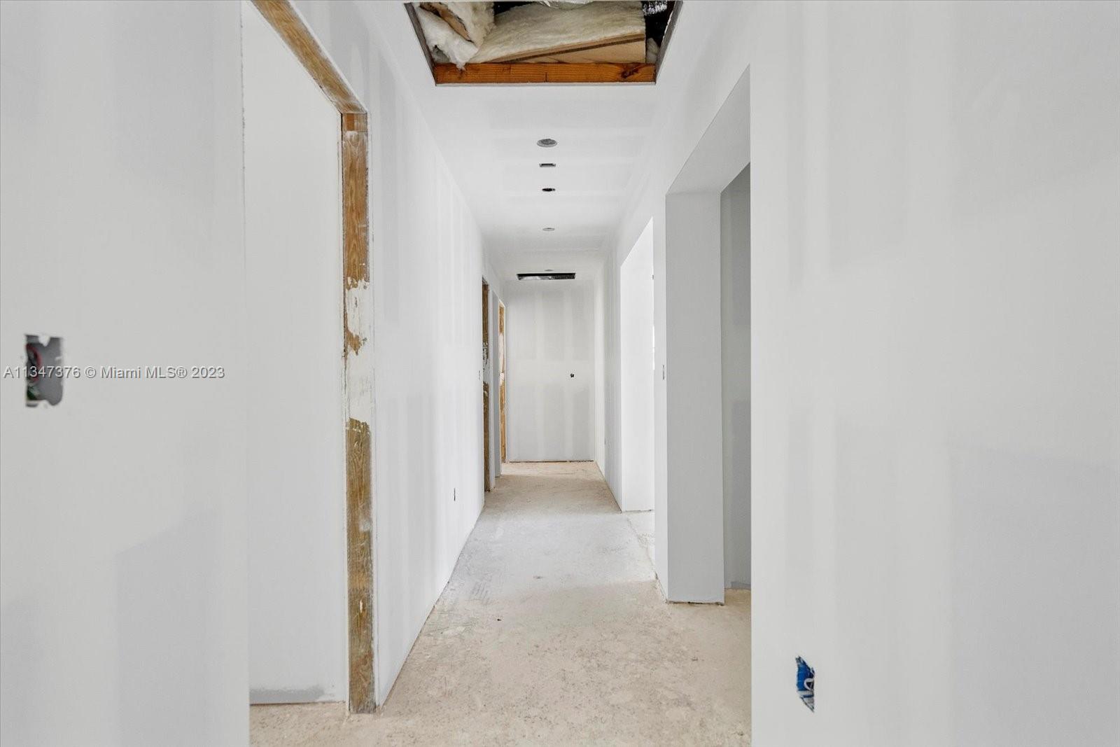 6230 Southwest 60th Street Miami, FL 33143 - Photo 35 of 57 a view of a hallway with white walls