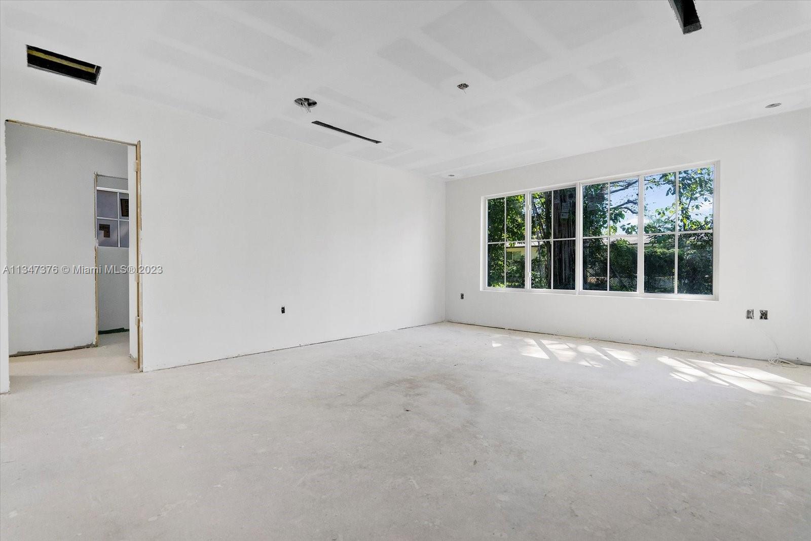 6230 Southwest 60th Street Miami, FL 33143 - Photo 43 of 57 a view of an empty room with a window