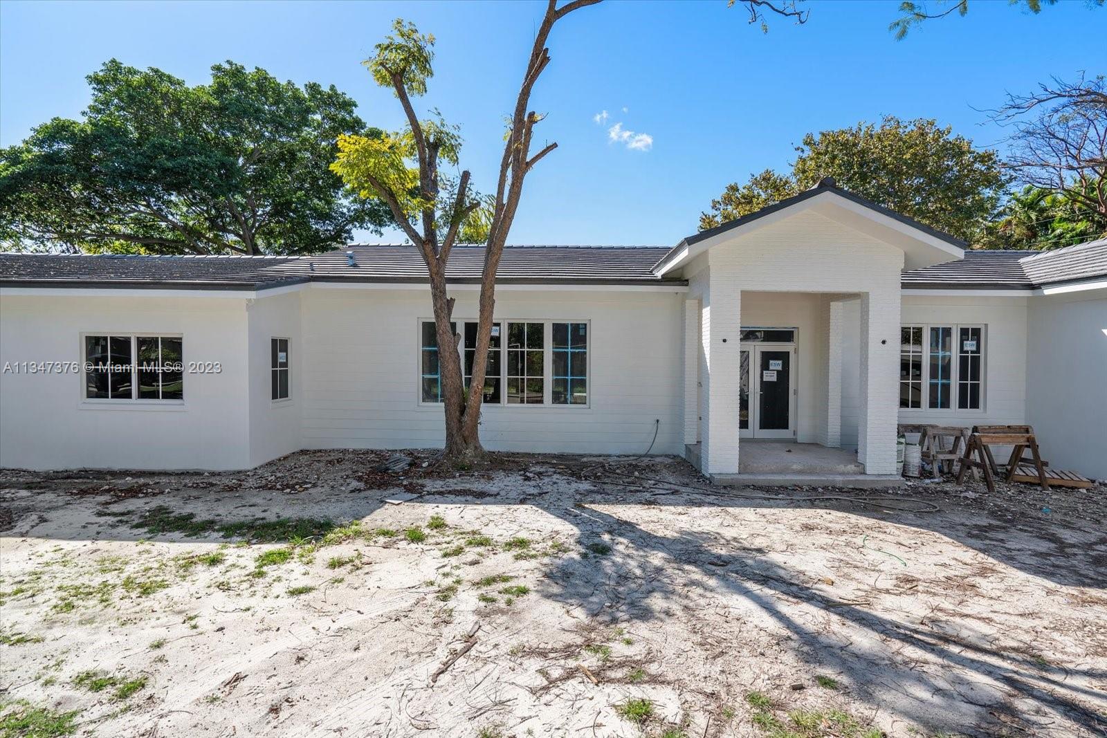6230 Southwest 60th Street Miami, FL 33143 - Photo 5 of 57 a view of a house with a yard