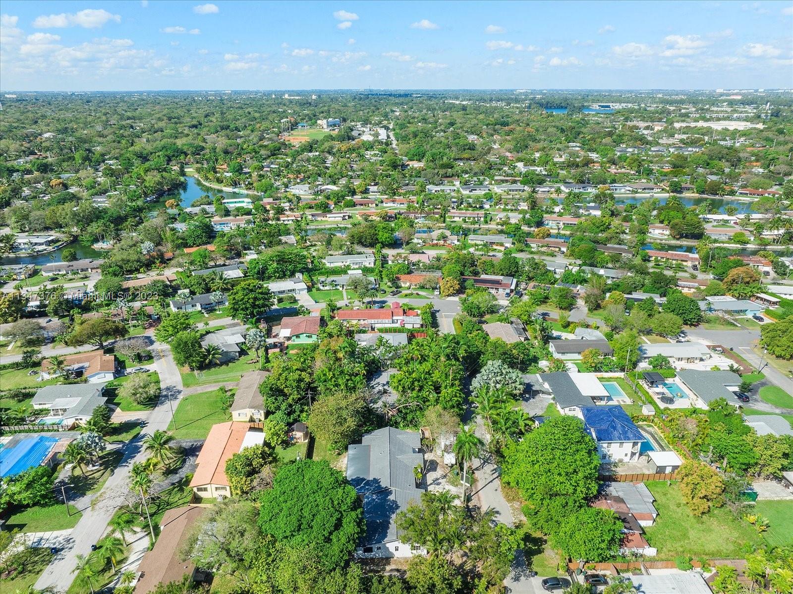 6230 Southwest 60th Street Miami, FL 33143 - Photo 53 of 57 an aerial view of residential houses with outdoor space and trees
