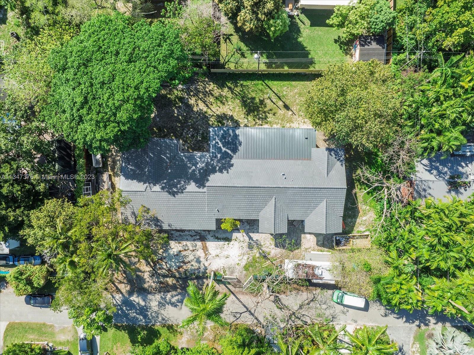 6230 Southwest 60th Street Miami, FL 33143 - Photo 55 of 57 an aerial view of a house with a yard and garden