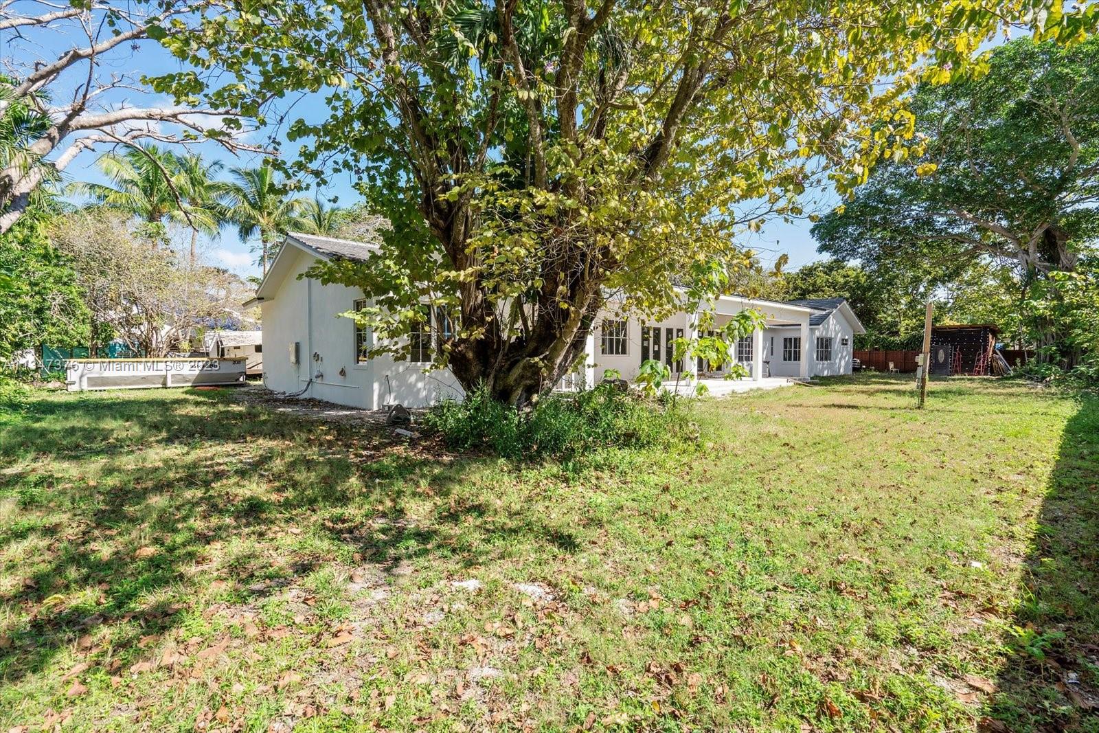 6230 Southwest 60th Street Miami, FL 33143 - Photo 56 of 57 a house view with a garden space
