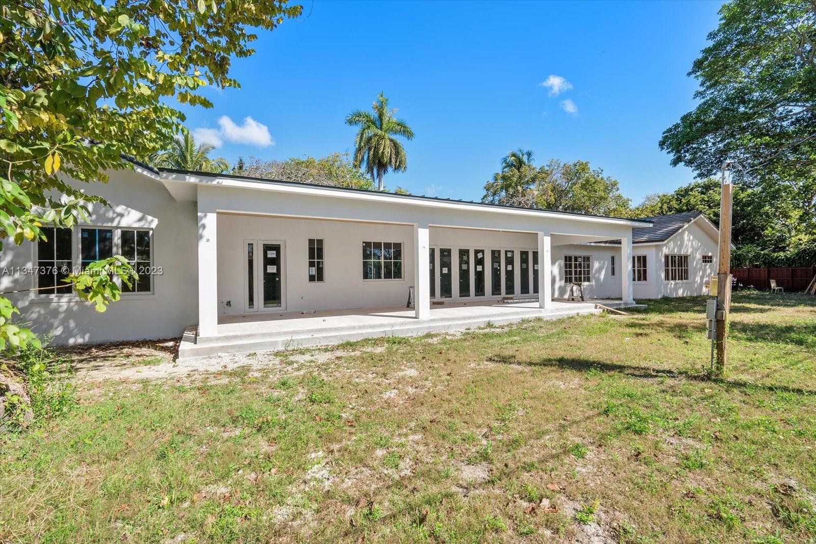 6230 Southwest 60th Street Miami, FL 33143 - Photo 7 of 57 a view of a house with a yard