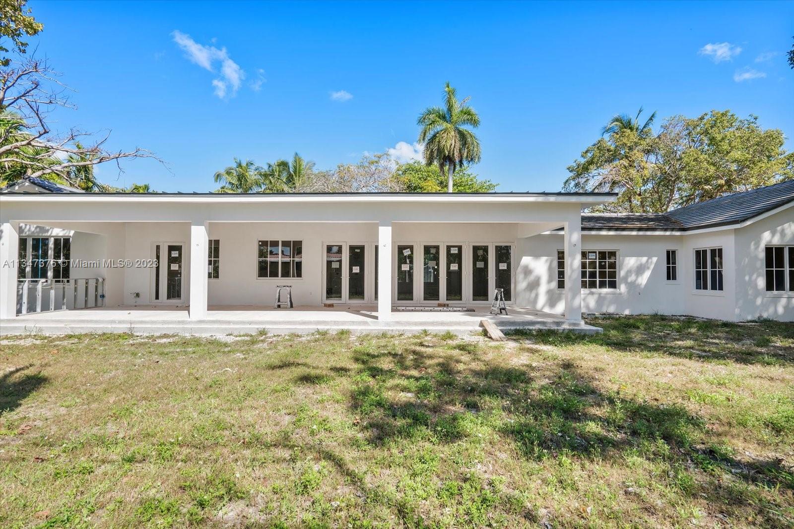6230 Southwest 60th Street Miami, FL 33143 - Photo 8 of 57 front view of a house with a big yard
