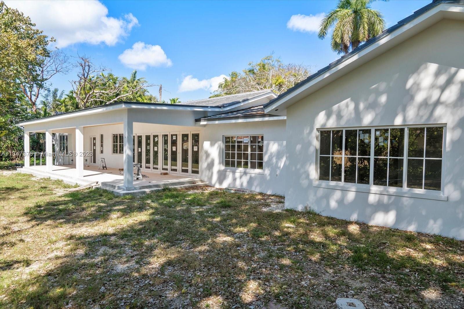 6230 Southwest 60th Street Miami, FL 33143 - Photo 10 of 57 a front view of a house with a garden