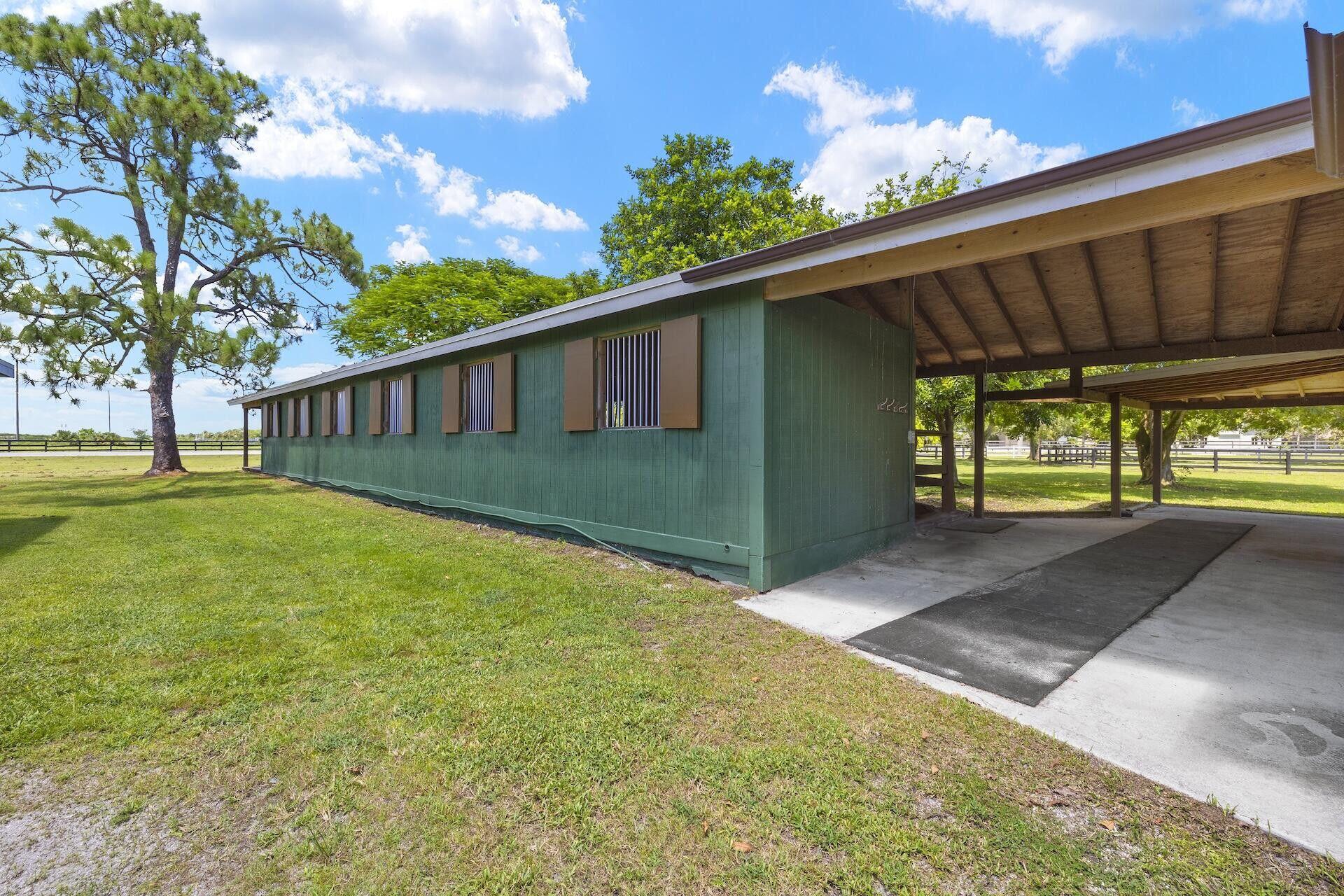 16031 Rustic Road Wellington, FL 33470 - Photo 4 of 11 a view of backyard with green space