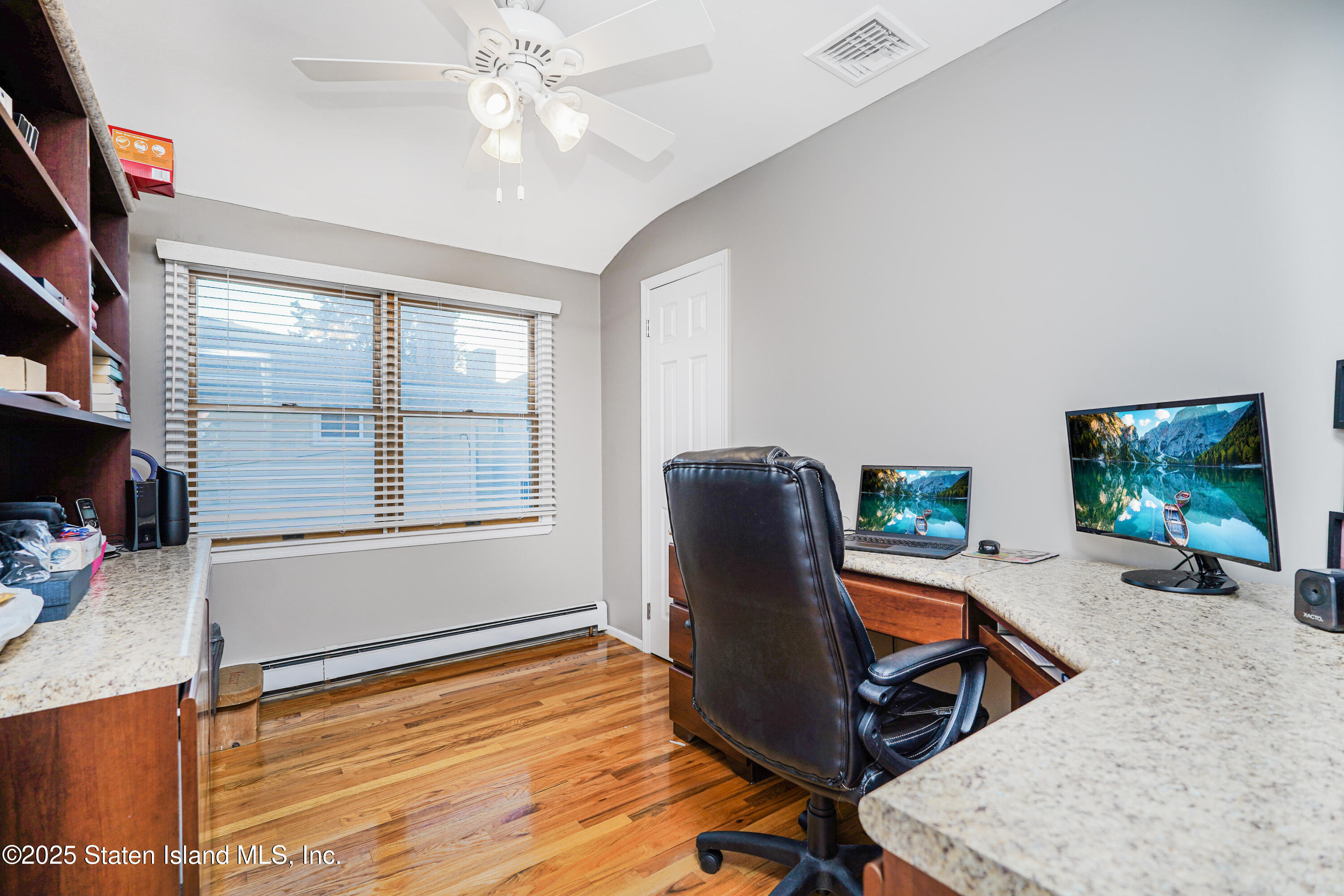 145 Shirley Avenue Staten Island, NY 10312 - Photo 18 of 29 a view of a workspace with furniture and a window