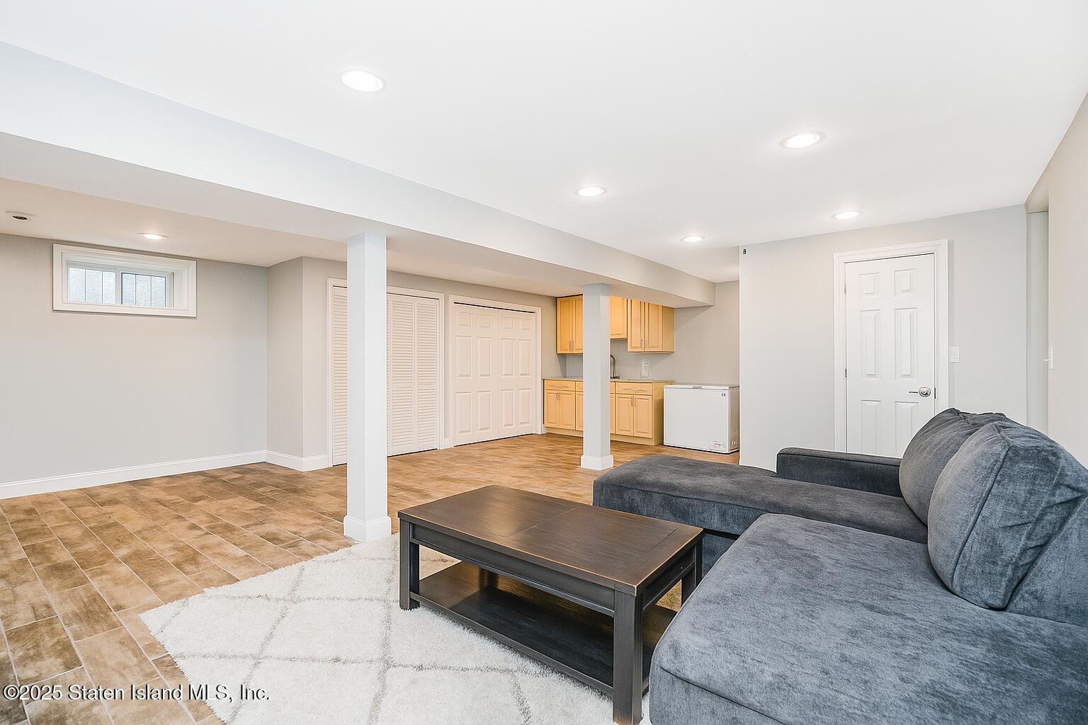 145 Shirley Avenue Staten Island, NY 10312 - Photo 23 of 29 a living room with furniture rug and window