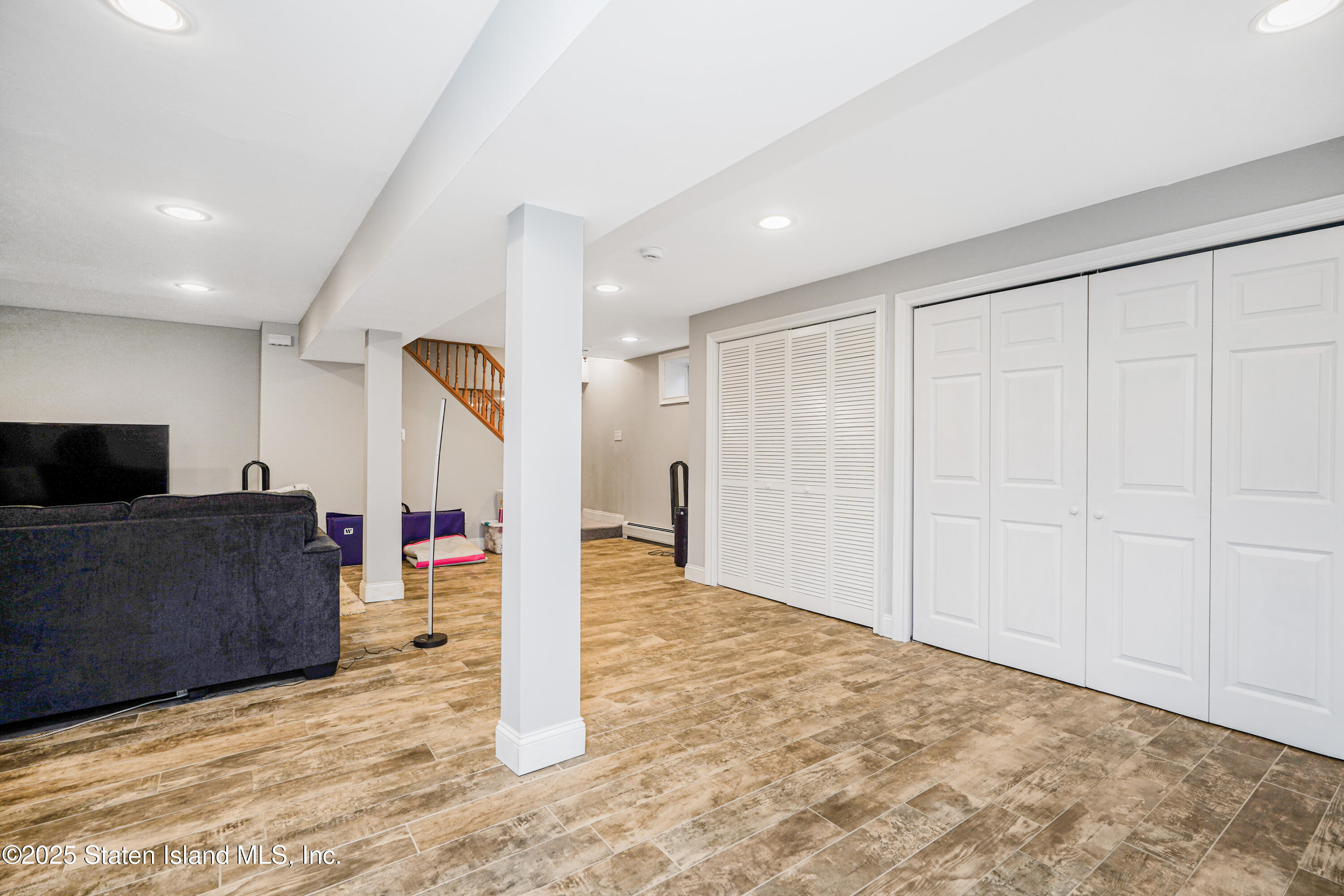 145 Shirley Avenue Staten Island, NY 10312 - Photo 25 of 29 a view of a livingroom with kitchen and furniture