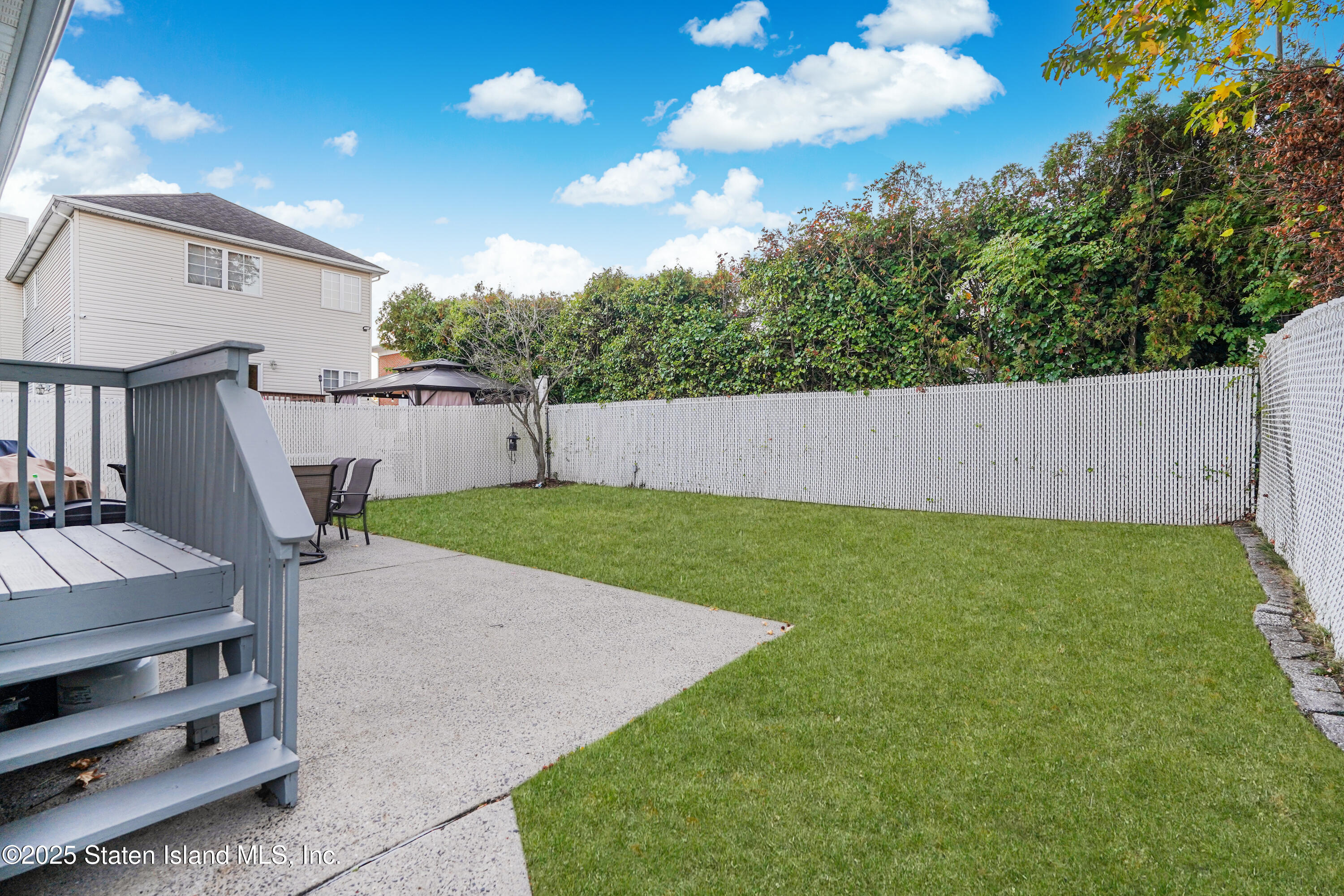 145 Shirley Avenue Staten Island, NY 10312 - Photo 27 of 29 a view of backyard with barbeque grill and a small yard
