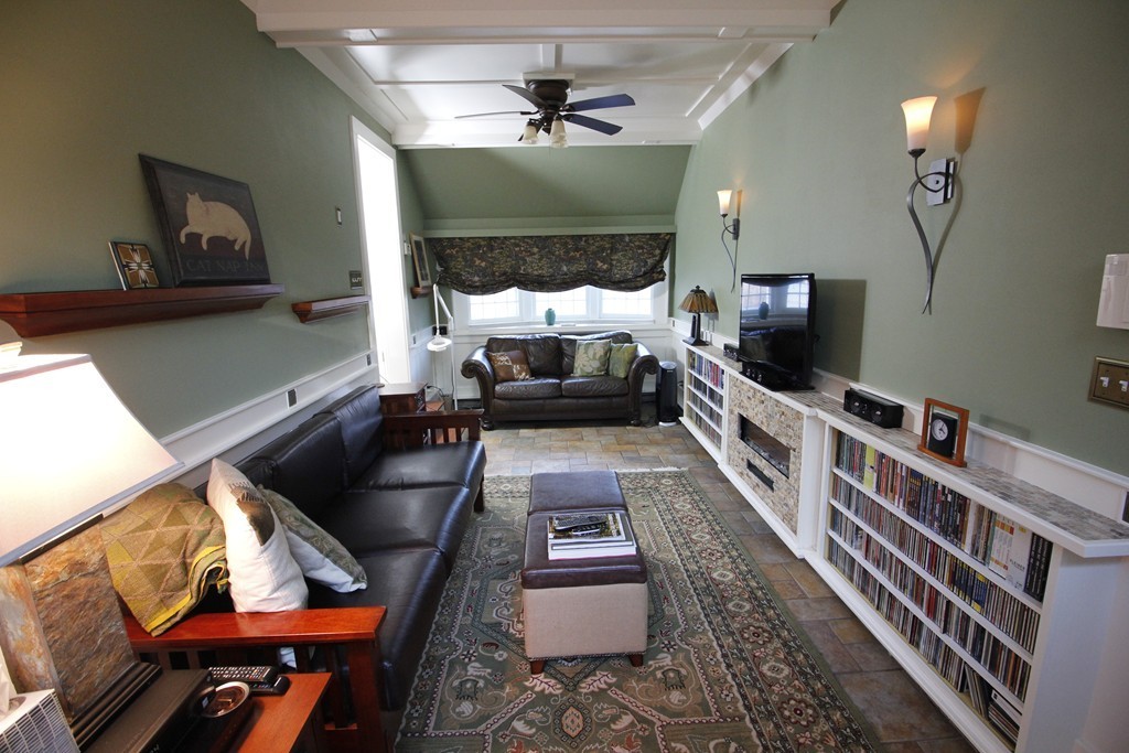 235 Haynes Road Sudbury, MA 01776 - Photo 7 of 24 a living room with furniture and a flat screen tv