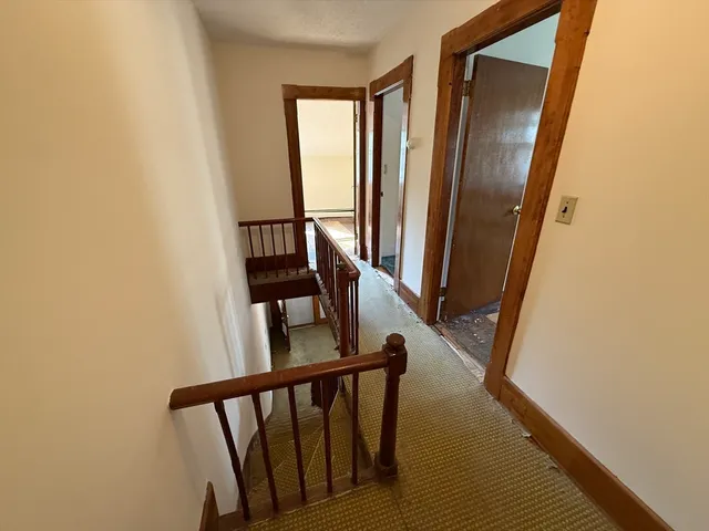 a view of entryway with wooden floor