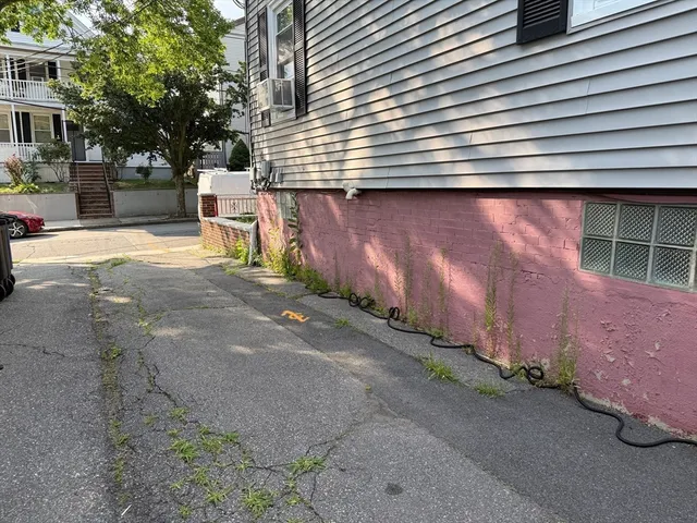 a backyard of a house with lots of green space and garage