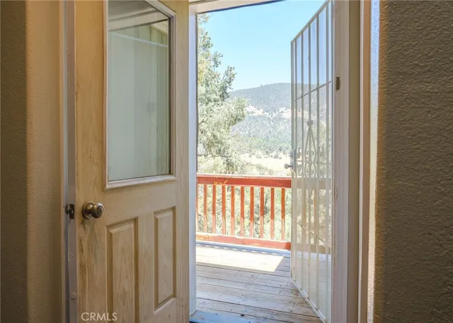 a view of a wooden door and outdoor space