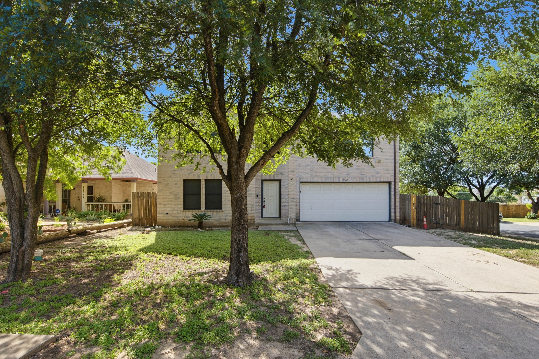 7900 Rosenberry Drive Austin, TX 78747 - Photo 26 of 27 A classic brick exterior and a paved driveway welcome you home.