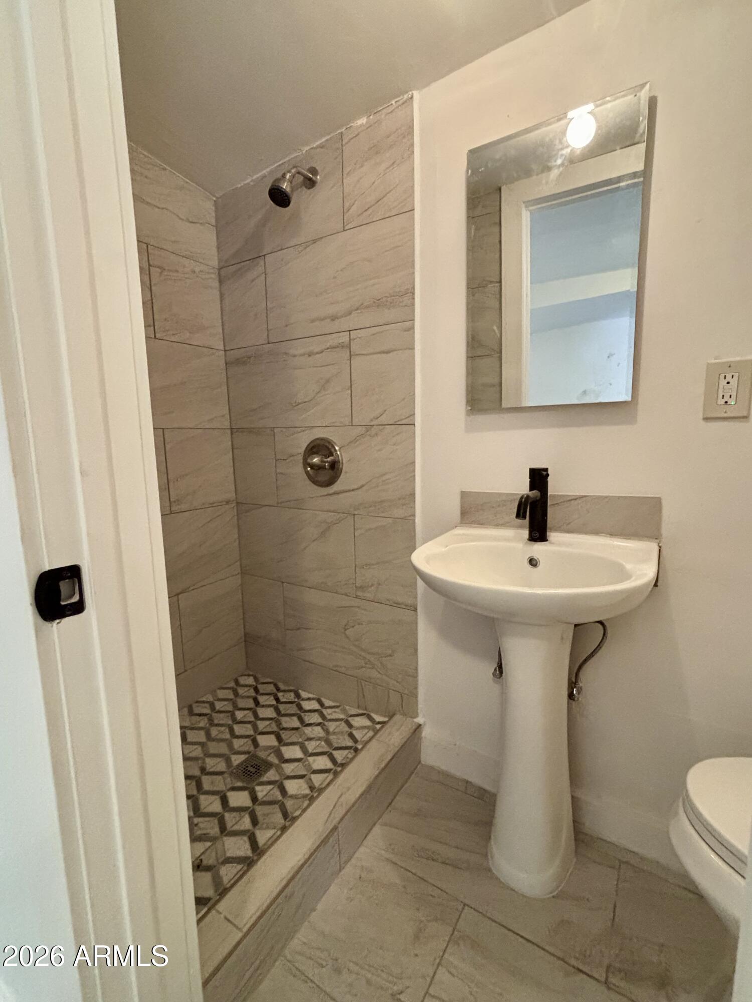 3036 West Almeria Road Phoenix, AZ 85009 - Photo 14 of 20 a bathroom with a sink toilet and shower