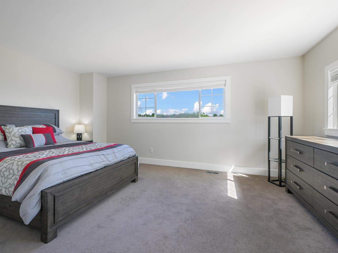 383 Explorer Court, Unit B Grand Junction, CO 81507 - Photo 20 of 40 a spacious bedroom with a bed and a cabinets
