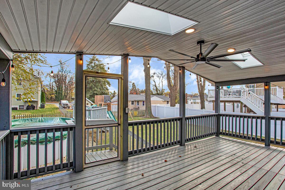 267 Lake Riviera Road Pasadena, MD 21122 - Photo 13 of 34 a view of a porch with wooden floor