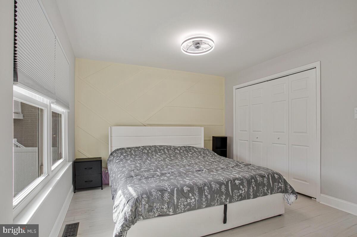 267 Lake Riviera Road Pasadena, MD 21122 - Photo 20 of 34 a bedroom with a bed and a couch