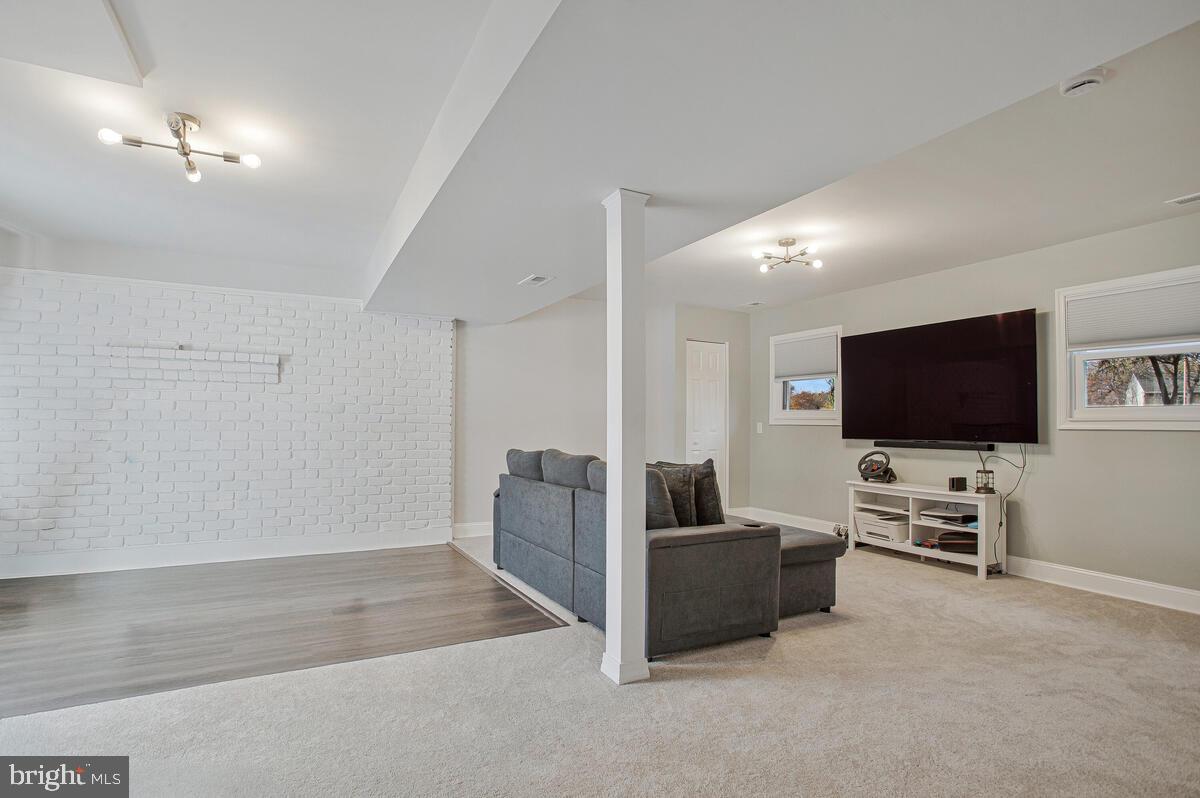 267 Lake Riviera Road Pasadena, MD 21122 - Photo 21 of 34 a living room with furniture and a flat screen tv