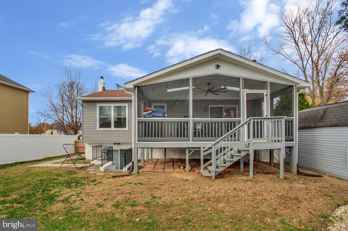 267 Lake Riviera Road Pasadena, MD 21122 - Photo 26 of 34 a view of a house with a window and wooden fence
