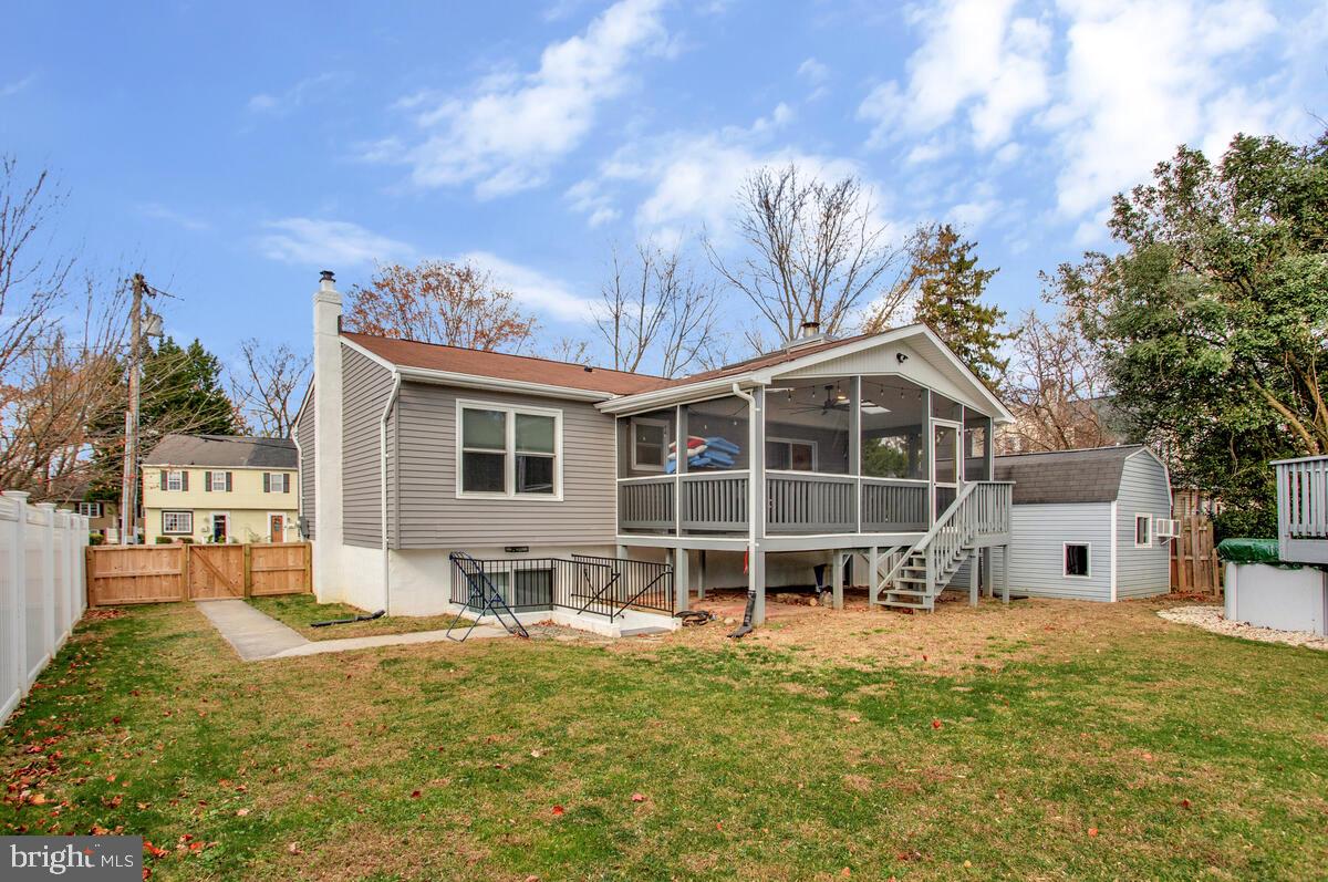 267 Lake Riviera Road Pasadena, MD 21122 - Photo 27 of 34 a front view of a house with a yard outdoor seating and barbeque oven