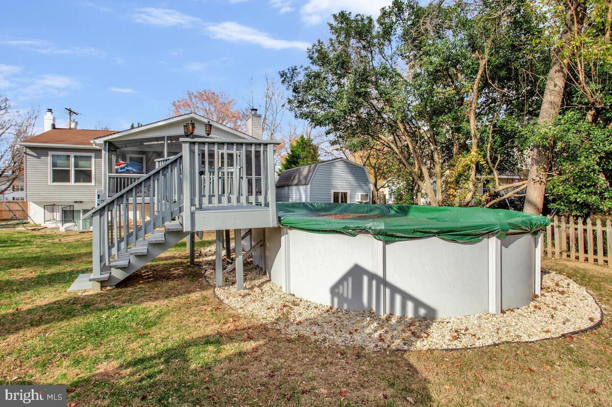 267 Lake Riviera Road Pasadena, MD 21122 - Photo 29 of 34 a view of a house with a yard from a patio