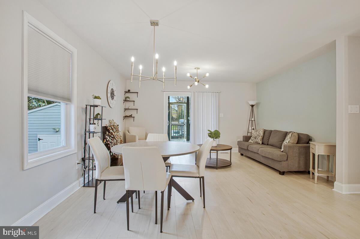 267 Lake Riviera Road Pasadena, MD 21122 - Photo 9 of 34 a living room with furniture and a chandelier
