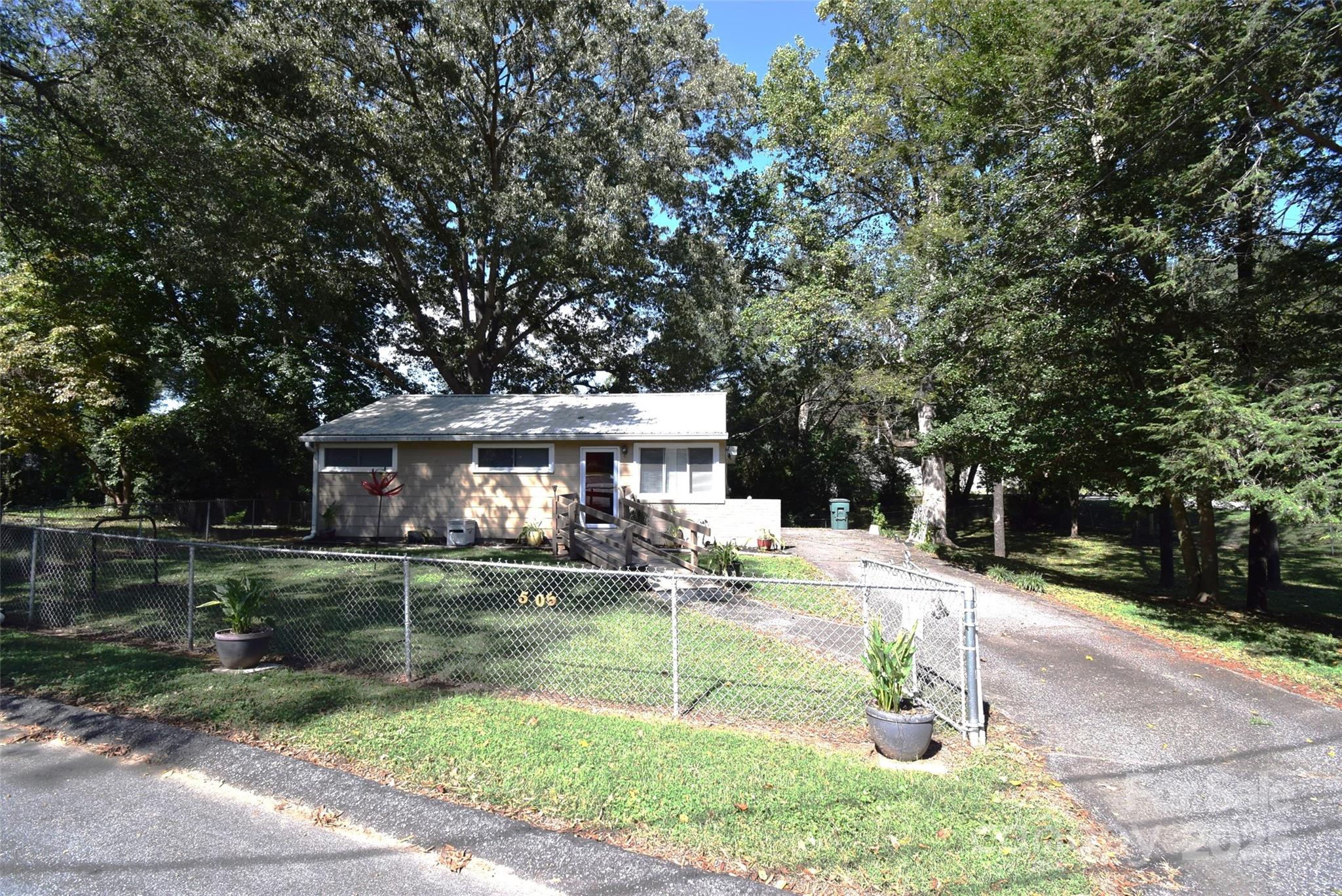 505 Butler Court Gastonia, NC 28054 - Photo 1 of 41 a backyard of a house with yard barbeque oven and outdoor seating
