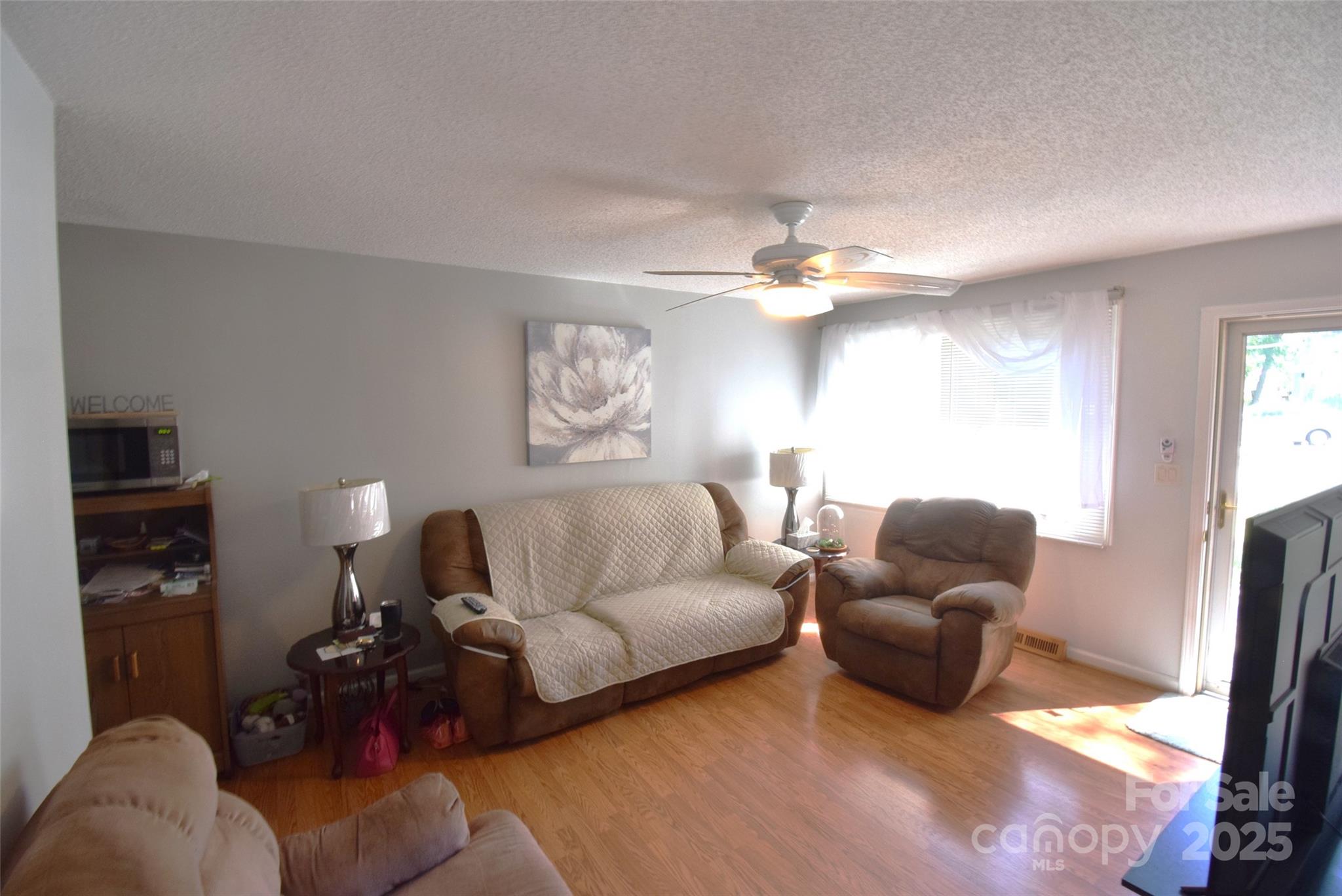 505 Butler Court Gastonia, NC 28054 - Photo 11 of 41 a living room with furniture and a flat screen tv