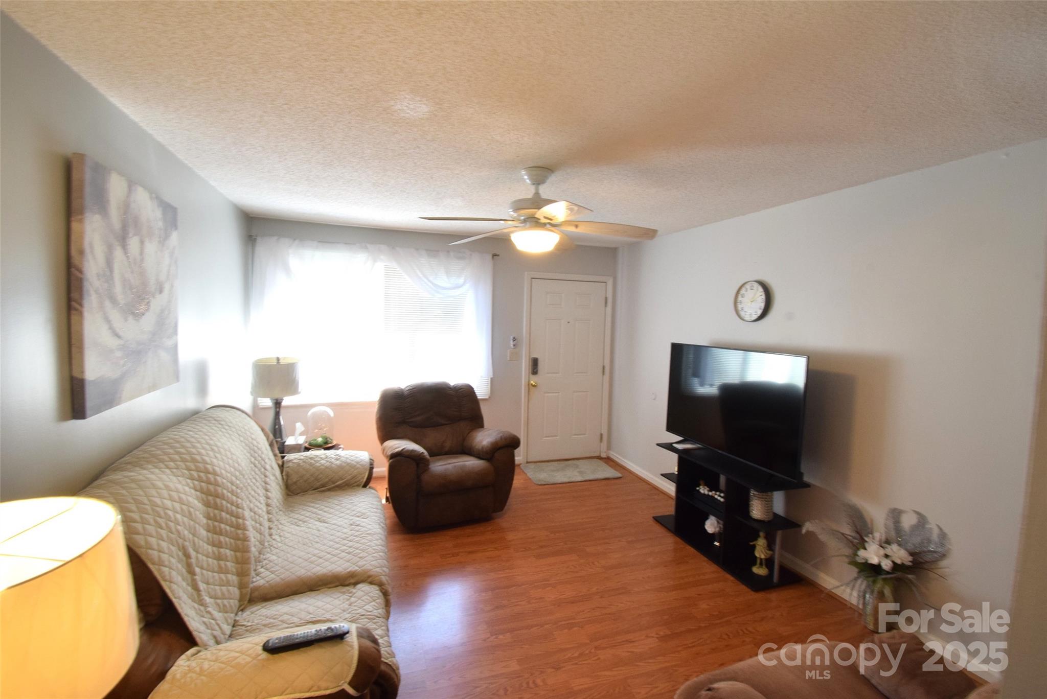 505 Butler Court Gastonia, NC 28054 - Photo 13 of 41 a living room with furniture and a flat screen tv