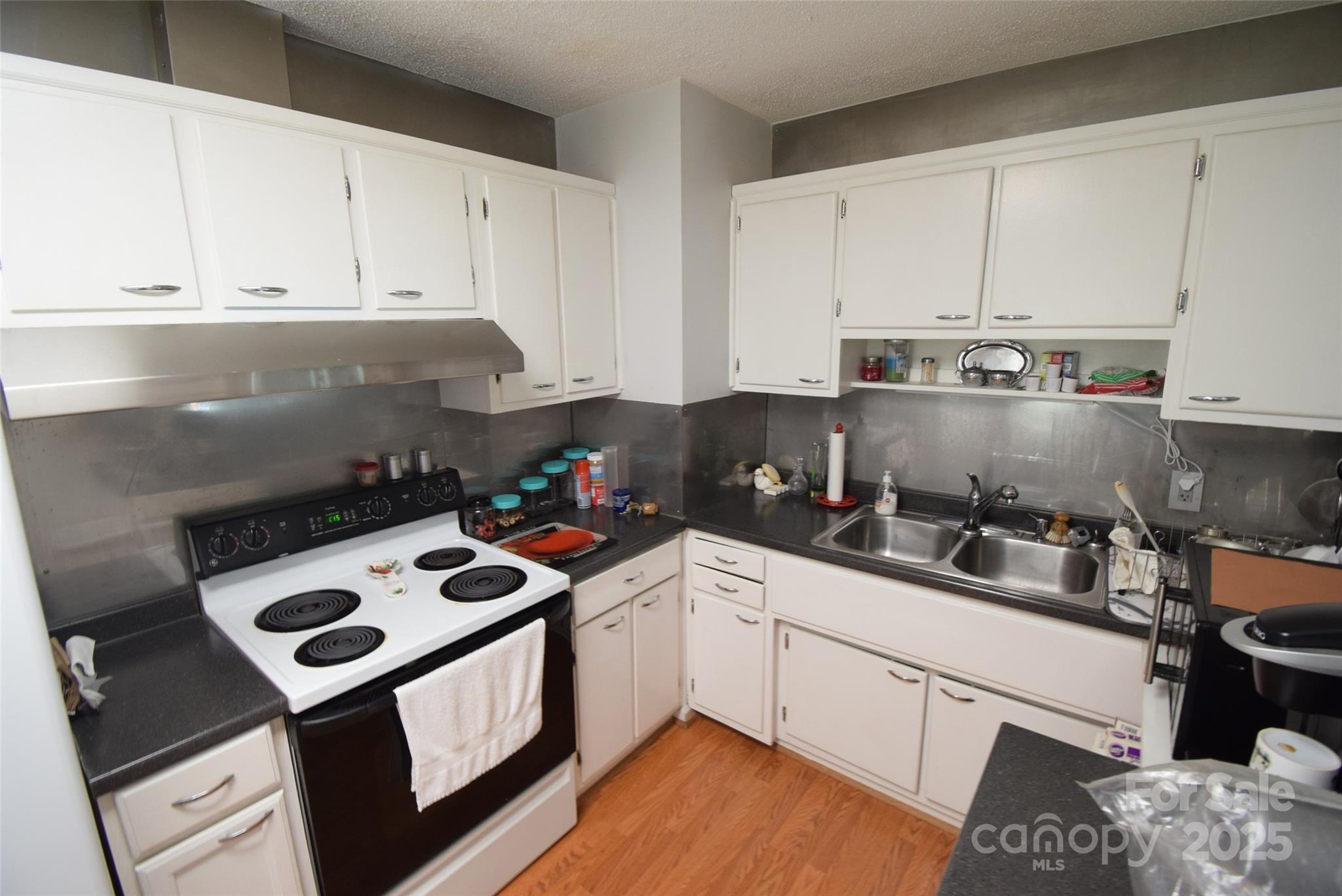 505 Butler Court Gastonia, NC 28054 - Photo 17 of 41 a kitchen with a sink a stove and cabinets