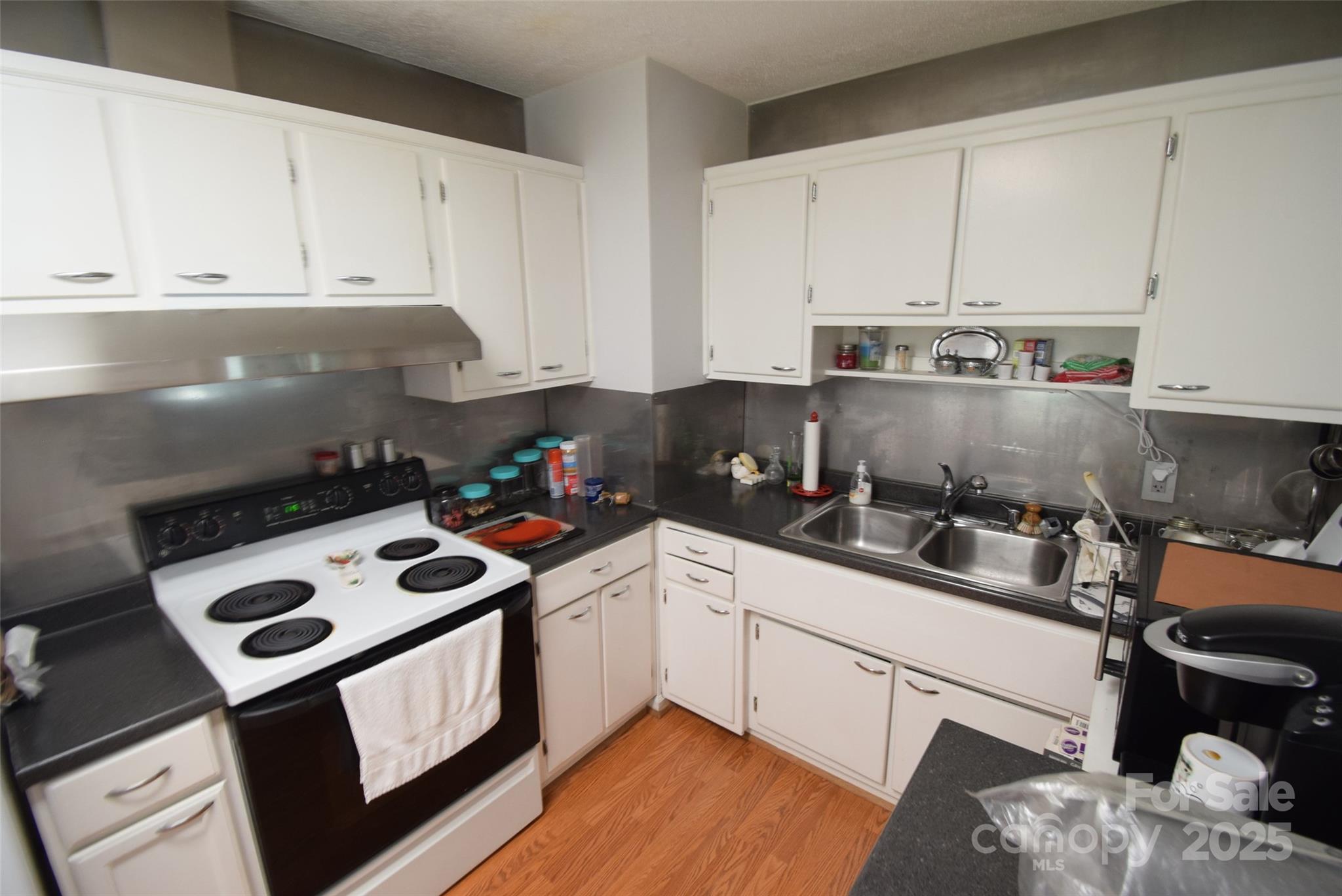 505 Butler Court Gastonia, NC 28054 - Photo 18 of 41 a kitchen with a white cabinets and white appliances