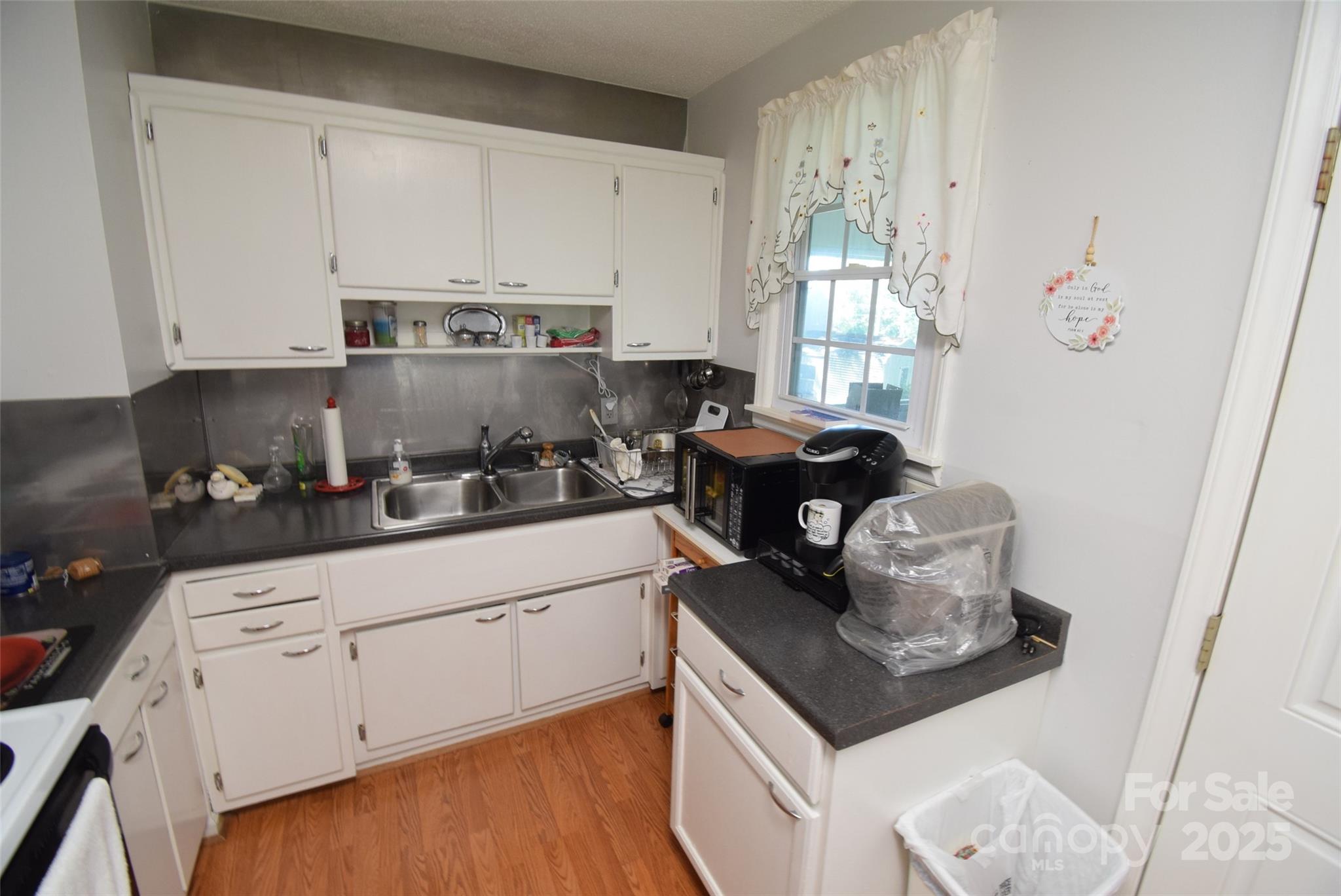 505 Butler Court Gastonia, NC 28054 - Photo 19 of 41 a kitchen with stainless steel appliances granite countertop a stove a sink and a white cabinets