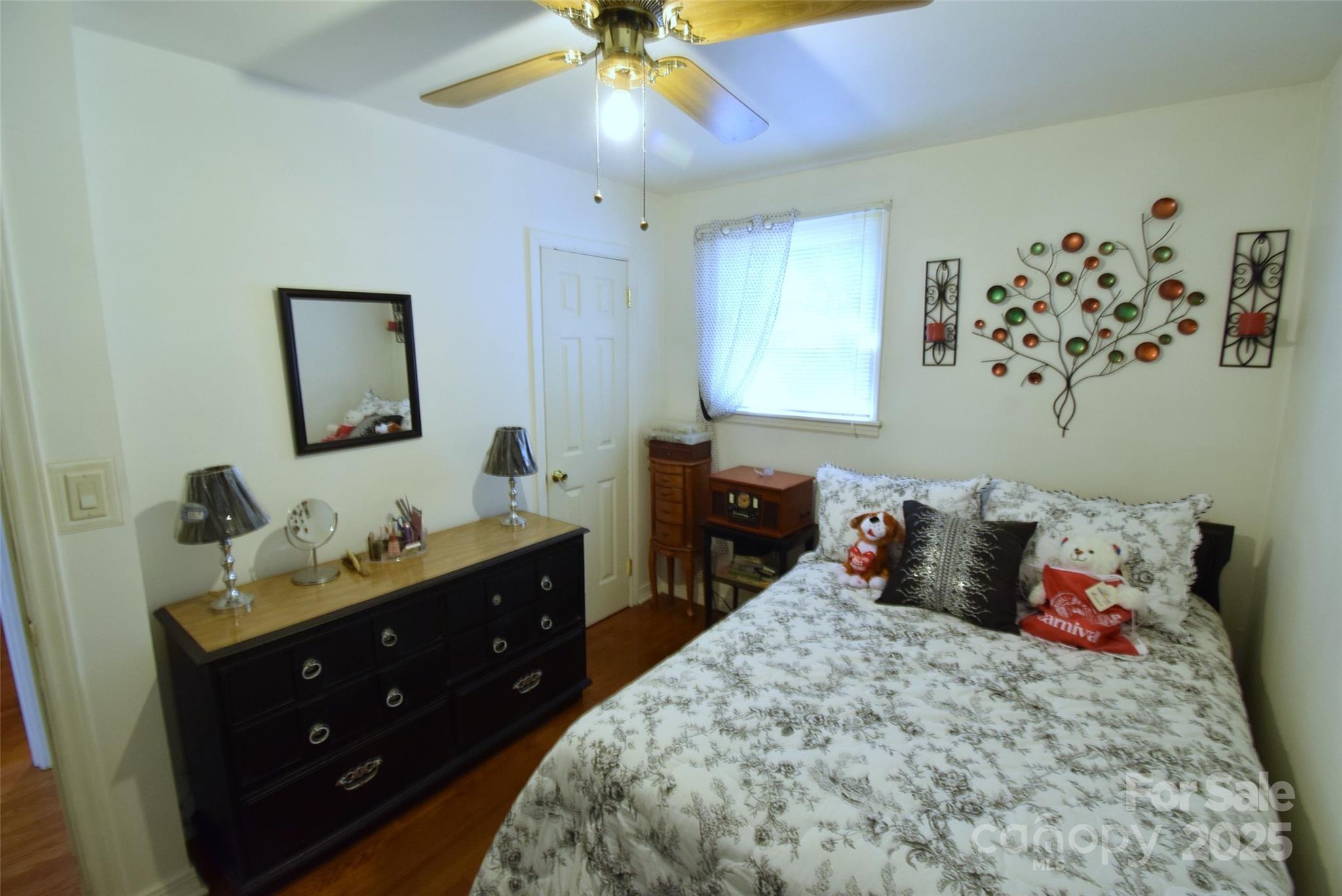 505 Butler Court Gastonia, NC 28054 - Photo 27 of 41 a bedroom with a bed and a chandelier