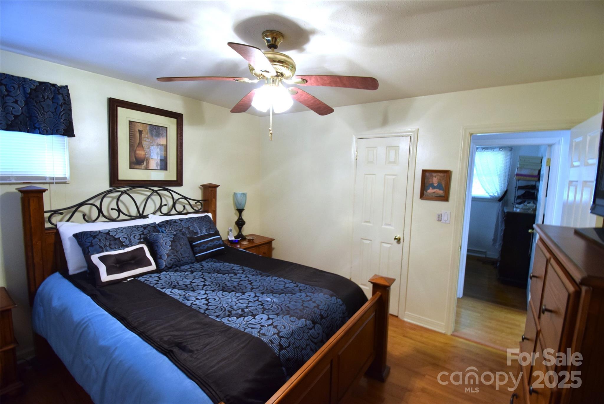 505 Butler Court Gastonia, NC 28054 - Photo 30 of 41 a bedroom with a large bed and a chandelier