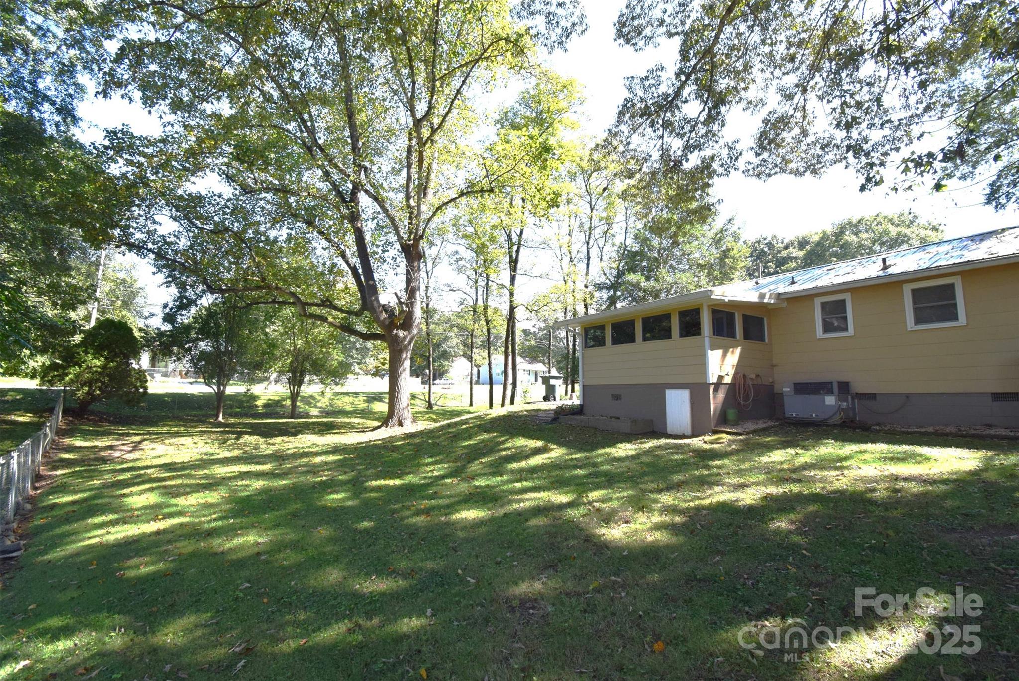 505 Butler Court Gastonia, NC 28054 - Photo 36 of 41 a view of a house with a big yard and a large tree