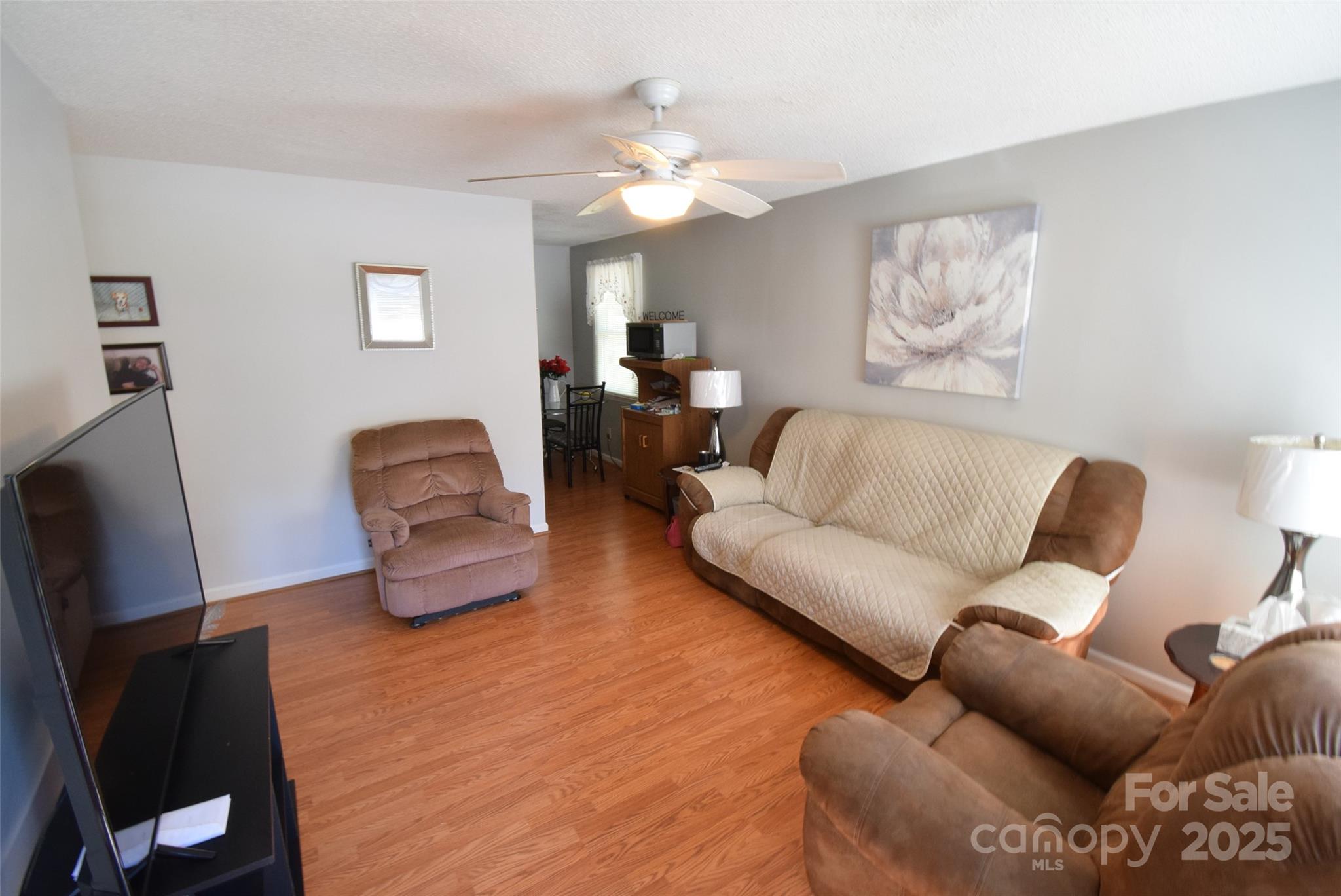 505 Butler Court Gastonia, NC 28054 - Photo 10 of 41 a living room with furniture and a flat screen tv