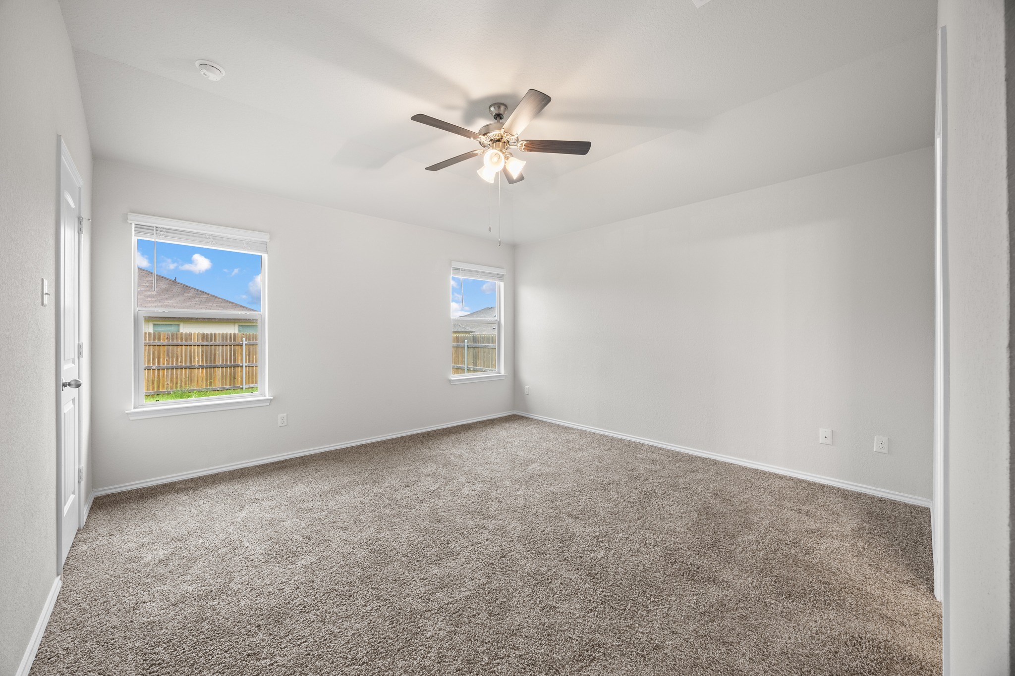 109 Gunther Way Taylor, TX 76574 - Photo 12 of 29 Spacious room featuring neutral carpeting and white walls