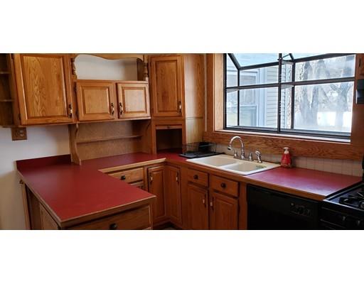 16 Goddard Road Framingham, MA 01702 - Photo 6 of 12 a kitchen with a sink cabinets and window