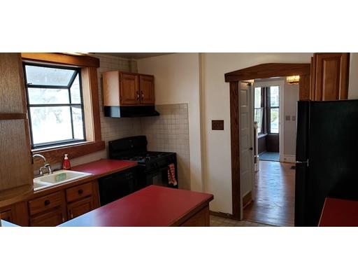 16 Goddard Road Framingham, MA 01702 - Photo 7 of 12 a kitchen with a sink and a refrigerator
