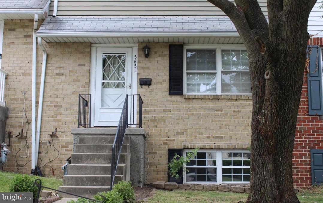 5651 Selford Road Halethorpe, MD 21227 - Photo 2 of 19 front view of a brick house with a small yard