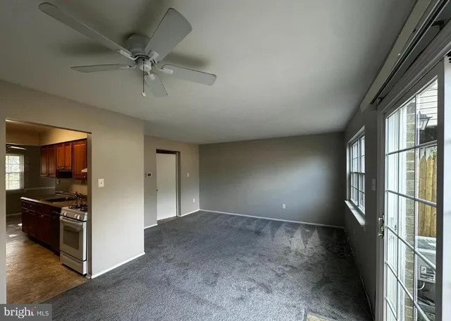 a view of a livingroom with a kitchen