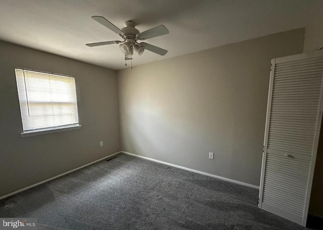 5651 Selford Road Halethorpe, MD 21227 - Photo 9 of 19 an empty room with a window and a fan